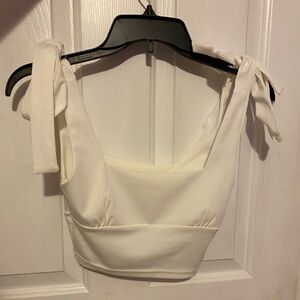 Adorable cropped white tank top with tied straps